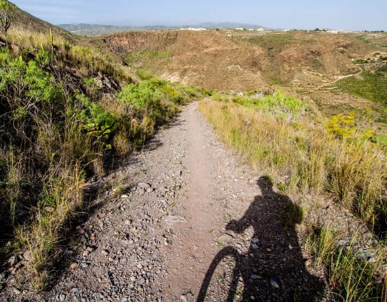 Rocky landscape and silhouette of cyclist